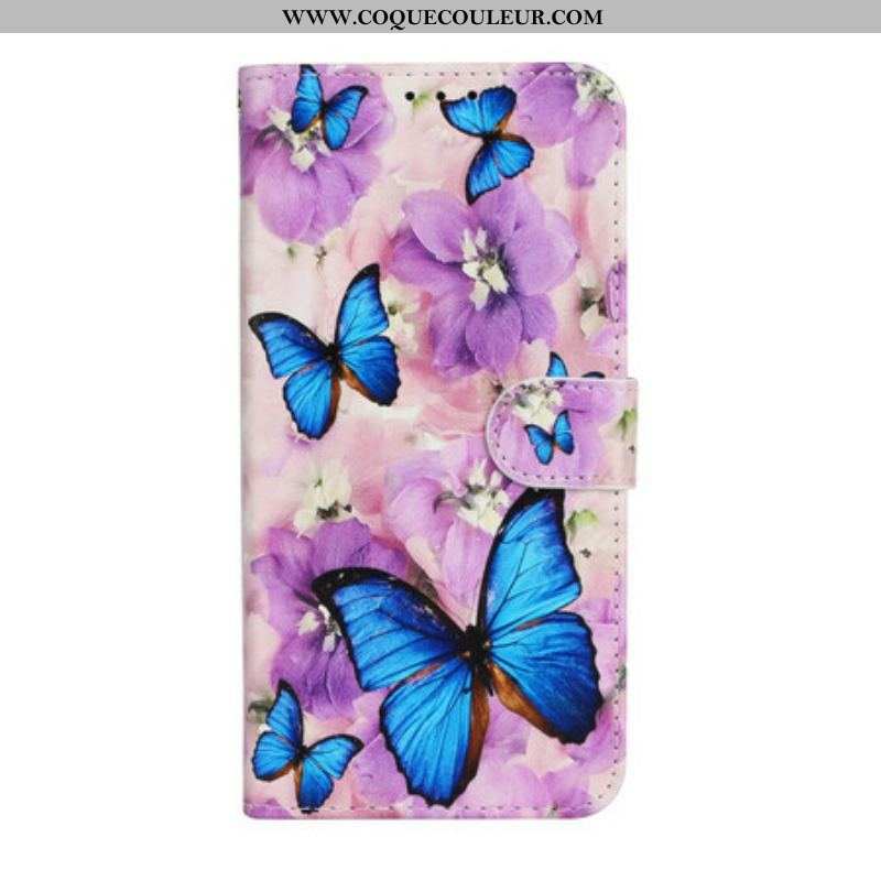 Housse iPhone 13 Mini Papillons Bleus dans les Fleurs