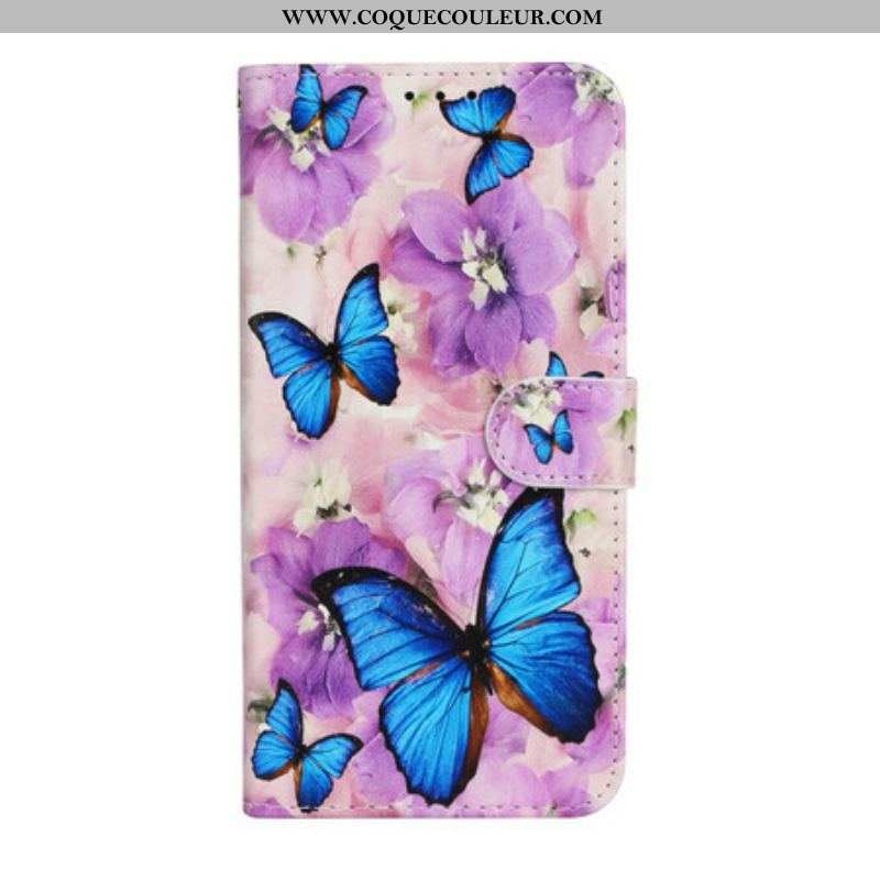 Housse iPhone 13 Mini Papillons Bleus dans les Fleurs